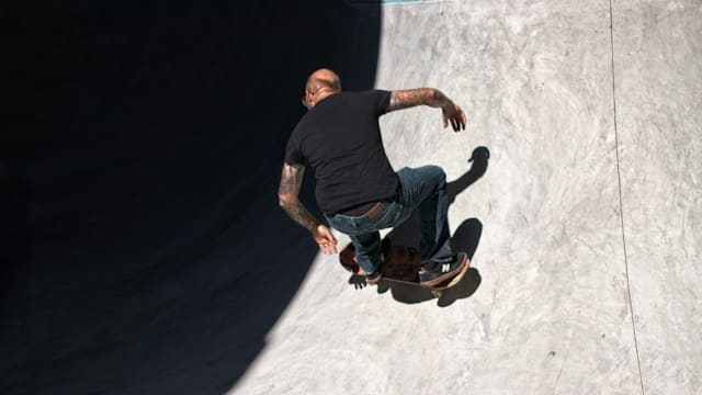 A photo of a person riding the skateboard, while performing various tricks and stunts